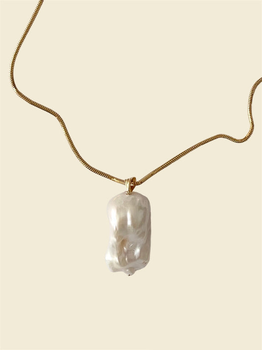 A 14k gold chain necklace with a thin rounded snake chain design, featuring a lobster clasp stamped with 585.