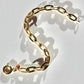 14 karat gold chunky chain bracelet with a chunky spring ring clasp